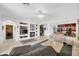 Bright living room with built-in shelving, fireplace, and open concept design at 9213 W Clara Ln, Peoria, AZ 85382