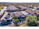 Aerial view showcases the property's serene backyard pool, lush landscaping, and proximity to nearby residences in a peaceful community at 9796 E Stone Cir Ln, Gold Canyon, AZ 85118