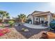 Beautiful backyard with a refreshing pool, covered patio, and desert-friendly landscaping at 9796 E Stone Cir Ln, Gold Canyon, AZ 85118