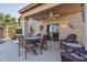 Inviting covered patio with comfortable seating, perfect for outdoor relaxation and entertaining at 9796 E Stone Cir Ln, Gold Canyon, AZ 85118