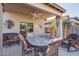 Relaxing covered patio with comfortable seating and stylish decor at 9796 E Stone Cir Ln, Gold Canyon, AZ 85118