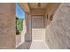 Inviting front entrance with a decorative security door and Southwestern-themed accents at 9796 E Stone Cir Ln, Gold Canyon, AZ 85118