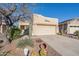 Single Gathering house with low-water desert landscaping and attached two car garage at 9796 E Stone Cir Ln, Gold Canyon, AZ 85118