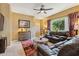 Cozy living room boasting comfortable seating, a ceiling fan, and a stylish rug, creating an inviting space for relaxation at 9796 E Stone Cir Ln, Gold Canyon, AZ 85118