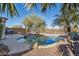 Backyard features a refreshing pool, desert landscaping, and privacy fencing at 9796 E Stone Cir Ln, Gold Canyon, AZ 85118