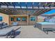 Outdoor space featuring a covered patio area with seating and a hot tub, perfect for relaxation and entertainment at 10039 W Jasmine Trl, Peoria, AZ 85383