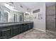 Primary bath featuring granite counters, dual sinks and decorative backsplash at 10039 W Jasmine Trl, Peoria, AZ 85383
