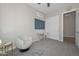 Bedroom with neutral walls and carpet, ceiling fan and desk at 10039 W Jasmine Trl, Peoria, AZ 85383