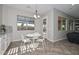 Bright breakfast nook features a modern light fixture and views of the backyard at 10039 W Jasmine Trl, Peoria, AZ 85383