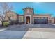 Beautiful single-story home featuring desert landscaping, stone accents, and a convenient two-car garage at 10039 W Jasmine Trl, Peoria, AZ 85383