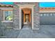 Inviting front door leading to a spacious hallway with stylish tile flooring and modern accents at 10039 W Jasmine Trl, Peoria, AZ 85383