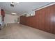Spacious garage with epoxy floors, large custom storage cabinets, and utility sink at 10039 W Jasmine Trl, Peoria, AZ 85383