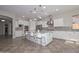 Spacious kitchen featuring a center island with seating, stainless appliances, and ample counter space at 10039 W Jasmine Trl, Peoria, AZ 85383