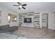 Spacious living room features an accent wall, large windows, and comfortable gray sofa at 10039 W Jasmine Trl, Peoria, AZ 85383