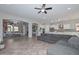 Open-concept living room showcases neutral color palette and flows into the gourmet kitchen at 10039 W Jasmine Trl, Peoria, AZ 85383
