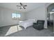 Main bedroom with soft carpet, ceiling fan and ensuite bathroom at 10039 W Jasmine Trl, Peoria, AZ 85383