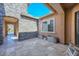 Cozy outdoor patio with travertine flooring, neutral colors, and tranquil desert views at 10039 W Jasmine Trl, Peoria, AZ 85383