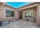 Comfortable outdoor patio featuring neutral decor, rocking chairs, and tranquil desert views at 10039 W Jasmine Trl, Peoria, AZ 85383