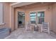 Relaxing outdoor patio featuring neutral decor, a small seating area, and tranquil ambiance at 10039 W Jasmine Trl, Peoria, AZ 85383
