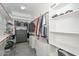 Walk-in closet with custom built-in shelving units at 10039 W Jasmine Trl, Peoria, AZ 85383