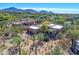 Stunning aerial view of the home, surrounded by desert landscape and scenic mountain views at 10040 E Happy Valley Rd # 249, Scottsdale, AZ 85255