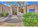 Inviting front entrance with desert landscaping and secure gated entry, creating curb appeal at 10040 E Happy Valley Rd # 249, Scottsdale, AZ 85255