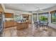 Bright kitchen features wooden cabinets, island, stainless steel appliances and a breakfast nook with a large window view at 10040 E Happy Valley Rd # 249, Scottsdale, AZ 85255