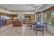 Spacious kitchen with wooden cabinets, stainless steel appliances, and a cozy dining area at 10040 E Happy Valley Rd # 249, Scottsdale, AZ 85255