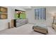 Bright living room featuring modern decor, a large TV, and comfortable seating at 10040 E Happy Valley Rd # 249, Scottsdale, AZ 85255