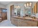 Main bathroom boasts double sinks, wooden cabinets and drawers and a luxurious bathtub at 10040 E Happy Valley Rd # 249, Scottsdale, AZ 85255