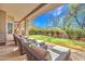 Spacious outdoor patio with lounge seating and a lush green lawn at 10040 E Happy Valley Rd # 249, Scottsdale, AZ 85255