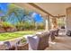Inviting outdoor patio with comfortable seating and a well-manicured lawn at 10040 E Happy Valley Rd # 249, Scottsdale, AZ 85255