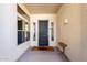 A neutral colored entryway featuring textured walls and a dark front door at 10511 W Villa Hermosa --, Peoria, AZ 85383