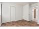 Bedroom with tile flooring and a large closet at 10541 W Pasadena Ave, Glendale, AZ 85307