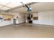 Well-organized garage with epoxy flooring, built-in cabinets, and ample storage solutions at 10617 E Michigan Ave, Sun Lakes, AZ 85248