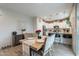 Bright dining area adjacent to the kitchen, perfect for Gathering meals and entertaining at 10822 W Taylor St, Avondale, AZ 85323