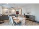 Open-concept dining area featuring wood-look tile floors and stylish decor at 10822 W Taylor St, Avondale, AZ 85323