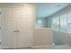 Bright upstairs hallway with closet and window overlooking the front yard at 10822 W Taylor St, Avondale, AZ 85323