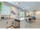 Bright kitchen with stainless steel appliances and view to the dining and living areas at 10822 W Taylor St, Avondale, AZ 85323