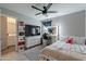 This bedroom features a vanity with a Hollywood mirror, a large TV, and ensuite access to the primary bathroom at 10822 W Taylor St, Avondale, AZ 85323