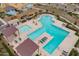 Aerial view of a community pool area with lounge chairs and shaded pergolas at 10822 W Taylor St, Avondale, AZ 85323