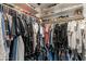 Large walk-in closet with shelving and clothing racks providing ample storage space at 10822 W Taylor St, Avondale, AZ 85323