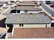 View of the rear of the house showcasing its tiled roof and desert rock landscaping at 1418 E Peggy Dr, Casa Grande, AZ 85122