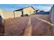 A spacious backyard with block wall fencing provides plenty of room for outdoor activities and landscaping at 1418 E Peggy Dr, Casa Grande, AZ 85122