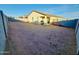 Expansive backyard enclosed by a block wall, offering privacy and potential for landscaping at 1418 E Peggy Dr, Casa Grande, AZ 85122