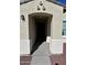 Welcoming front entrance featuring a covered porch, and black front door at 1418 E Peggy Dr, Casa Grande, AZ 85122