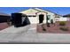 Inviting single-story home featuring desert landscaping and a two-car garage at 1418 E Peggy Dr, Casa Grande, AZ 85122