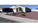 Charming single-story home with manicured desert landscaping and an attached two-car garage at 1418 E Peggy Dr, Casa Grande, AZ 85122