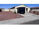 Well-maintained home with a tidy front yard, mature desert landscaping and a two-car garage at 1418 E Peggy Dr, Casa Grande, AZ 85122