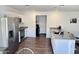 Well-lit kitchen featuring white cabinetry, stainless steel appliances, and a breakfast bar at 1418 E Peggy Dr, Casa Grande, AZ 85122